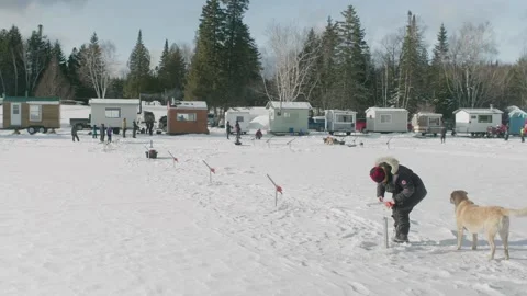 Tiny Ice Huts On Frozen White Lake Megantic In Quebec With People With Stock Footage 153444431