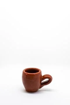 Tiny iconic brown hot chocolate mugs isolated on a white background Stock Photos