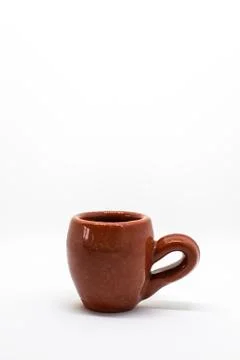 Tiny iconic brown hot chocolate mugs isolated on a white background Stock Photos