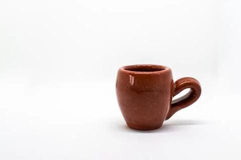 Tiny iconic brown hot chocolate mugs isolated on a white background Stock Photos