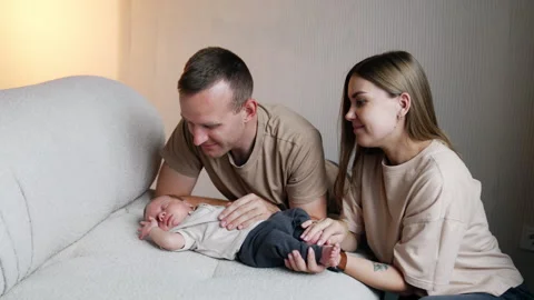 Tiny infant boy sleeping on the sofa. Stock Footage 250574346