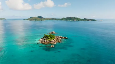 Tiny island amidst a vast blue ocean. Seychelles. Stock Footage 310041729