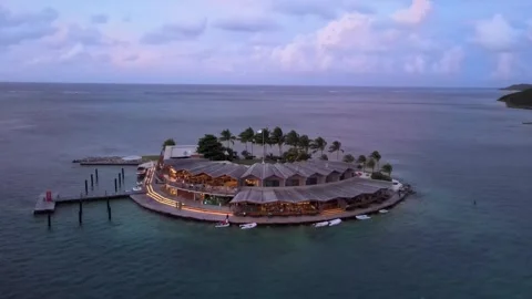 Tiny island at sunset Stock Footage 246715360