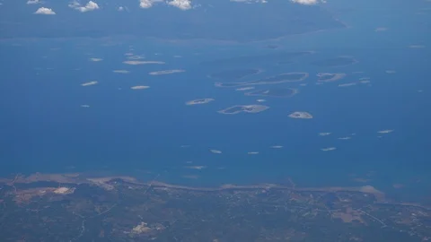 Tiny islands in channel between 2 bigger islands Stock Footage 112483478