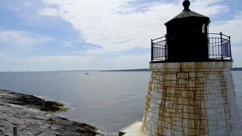 A tiny lighthouse protects ships as they enter the bay in Newport Rhode Video stock 113040791