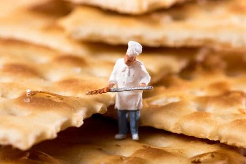 Tiny little figure of a chef in a cracker biscuit Stock Photos