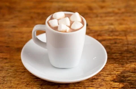 A Tiny LIttle Mug Filled with Hot Chocolate for a Child called a Babyccino Stock Photos