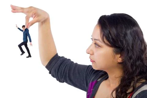 Tiny Man Being Held By A Gigantic Woman Foto stock