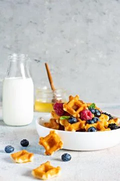 Tiny (Mini) waffles waffles with milk for breakfast Stock Photos