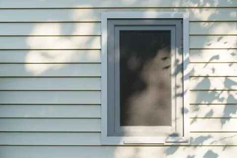 Tiny mobile house wall and window with shadow from the tree Stock Photos