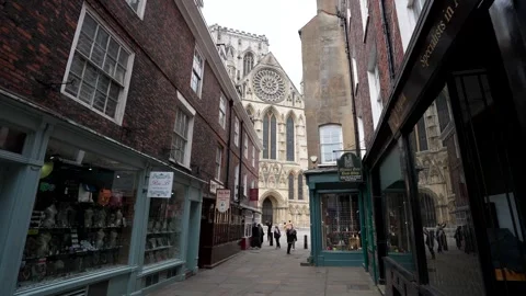 Tiny narrow York city centre streets with people and Minster Cathedral Video stock 276099147
