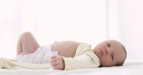Tiny newborn baby on white close-up Stock Footage 93539193