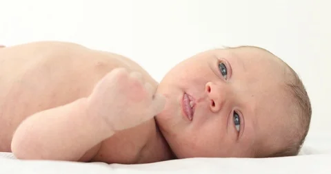Tiny newborn baby on white Stock Footage 93535715