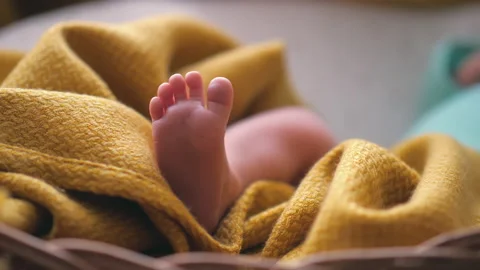 Tiny Newborn Baby's feet closeup. Mom and her Child. Happy Family concept Video stock 151861736