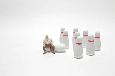 A tiny of people Figurines and Bowling Ball 写真素材