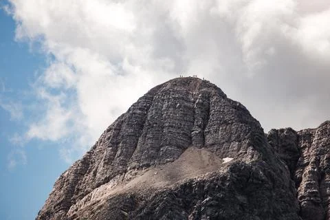 Tiny people on mountain Stock Photos