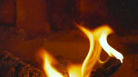 Tiny piece of wood burning in the fireplace dolly out Stock Footage