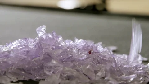 Tiny Pieces Of Purple Plastic Fall In Slow Motion Stock Footage 78617129