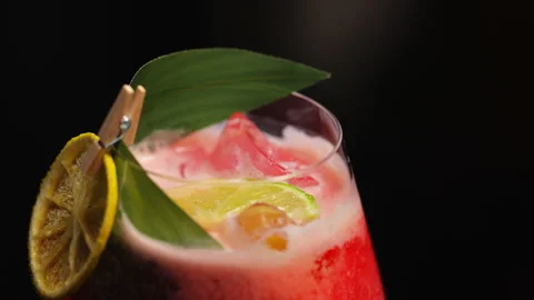 Tiny pin attaching leaf and dried lemon wheel to glass Stock Footage 275823761