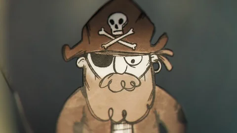 A tiny pirate character made out of paper commanding his ship to attack. 4KHD Stock Footage 110127592