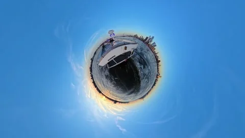 Tiny Planet effect of ferry boat on frozen Hudson River at sunset, New York 動画素材 305052791