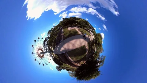 Tiny Planet –  Ferris Wheel at Funfair in Pyongyang- 360° Stock Footage 99842436