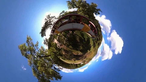 Tiny Planet –  Fun ride on train at Funfair in Pyongyang- 360° Stock Footage 99843140