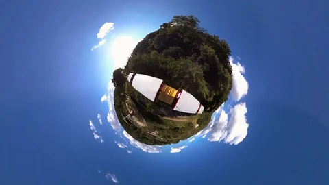 Tiny Planet –  Fun ride on train at Funfair in Pyongyang- 360° Stock Footage 99843276