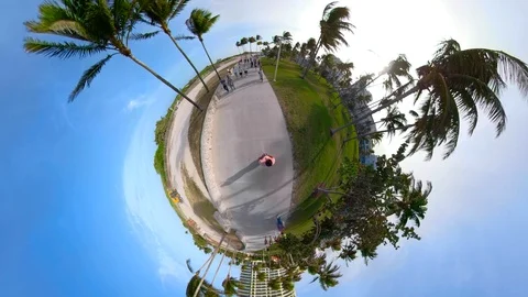 Tiny planet Miami Beach Ocean Drive pedestrian pathway Stock Footage 85772924