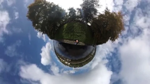 Tiny planet people running beside river Stock Footage 80606574