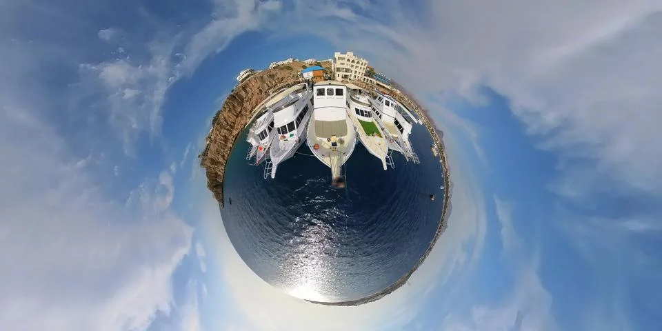 A tiny planet view of dive boats moored at the marina in Sharm, Egypt Stock Photos