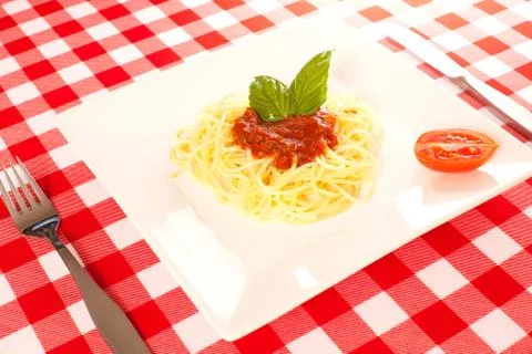 Tiny portion of spaghetti on a plate Stock Photos