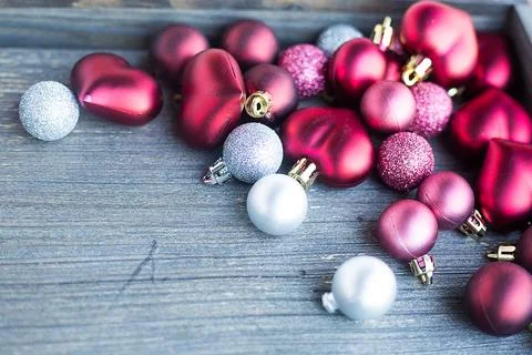 Tiny red and silver decorations for Christmas tree. New year toys, hearts and Stock Photos