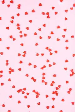 Tiny red hearts on pink background. 写真素材