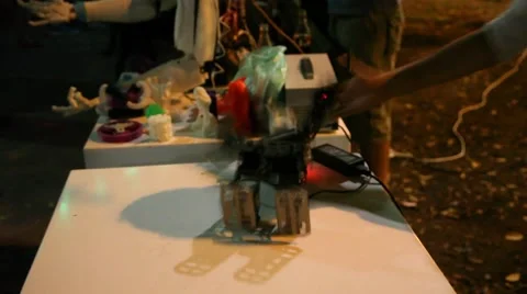 A tiny robot dances and stretches his muscles Видео 54505136