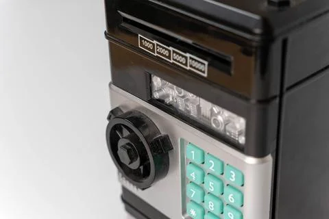 Tiny safe model on clean white background with space for text Stock Photos