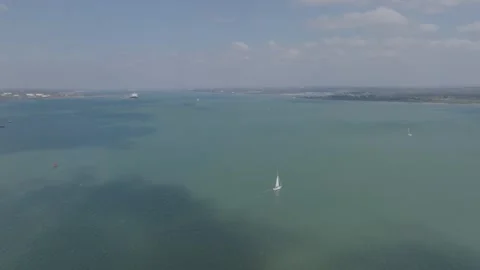 Tiny sailing boat in open sea Stock Footage 306620683