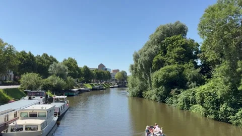 Tiny sails through canal at Groningen city centre. Netherlands Stock Footage 341938323