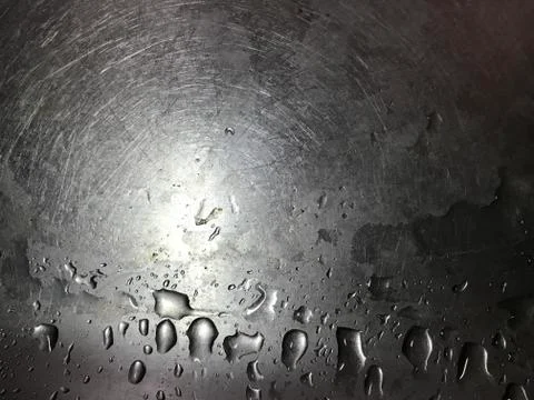 Tiny scratches on smooth metal surface with water drops Stock Photos