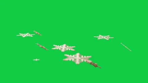 Tiny shape appearing at top driving cream stars drifting clumping then settling Stock Footage 348242488