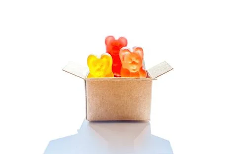 Tiny shipping box with bear shaped candies Foto stock
