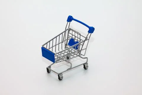 A tiny shopping cart on isolated background Stock Photos