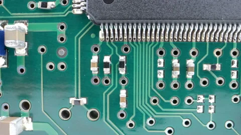 The tiny silver wires on the side of the green circuit board Video stock 137357691