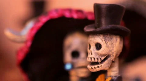 Tiny skeleton sculptures dressing evening dress in a handicraft shop. Stock Footage 60699030