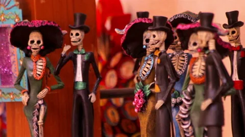 Tiny skeleton sculptures dressing evening dress in a handicraft shop. Stock Footage 60699724