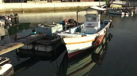 Tiny Small Fishing Boat A Dock In Harbor Good Reflections 4K Stock Footage 44863056