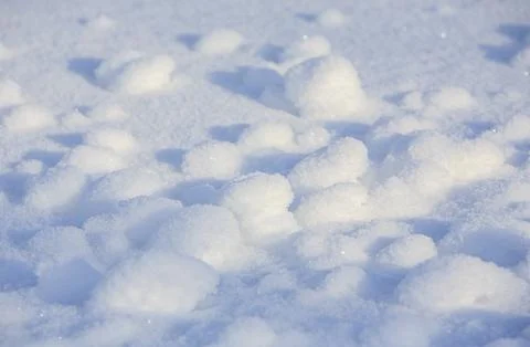 Tiny snowballs on snow surface at Winter, Finland 스톡 사진