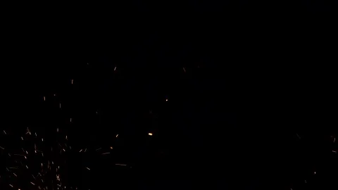 Tiny sparks and fire flare on black background Stock Footage 150708680
