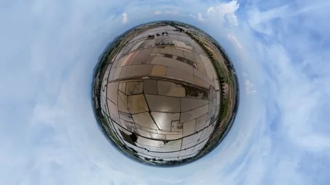 Tiny sphere captures sky and earth in perfect round frame 動画素材 345396057