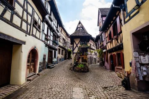Tiny square leading to two streets lined up with beautiful half-timbered hous Stock Photos